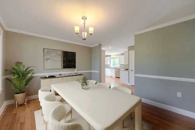 a very nice looking dining room with a table and chairs