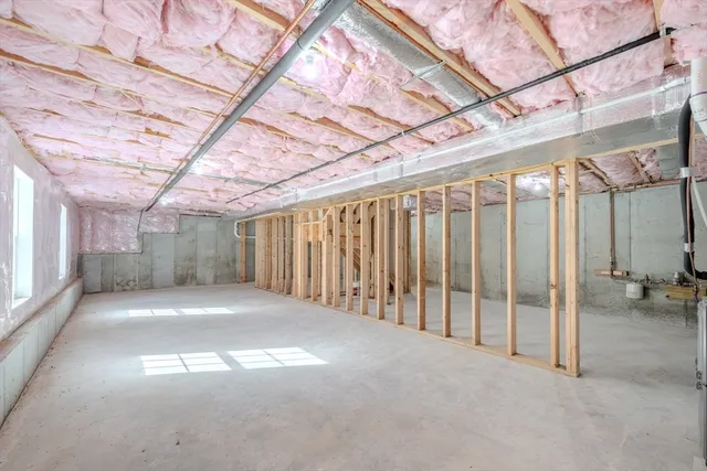 a view of a hall with wooden floor