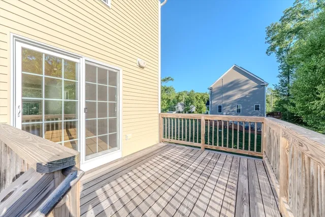 a view of a deck with wooden floor and fence