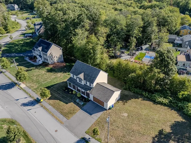 an aerial view of a house with outdoor space