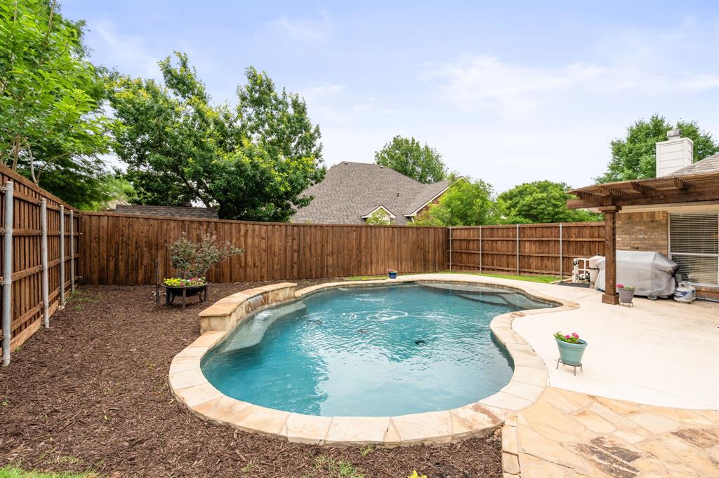 205 Crepe Myrtle Lane Murphy, TX 75094 - Photo 29 of 33 a view of a swimming pool with a sitting area