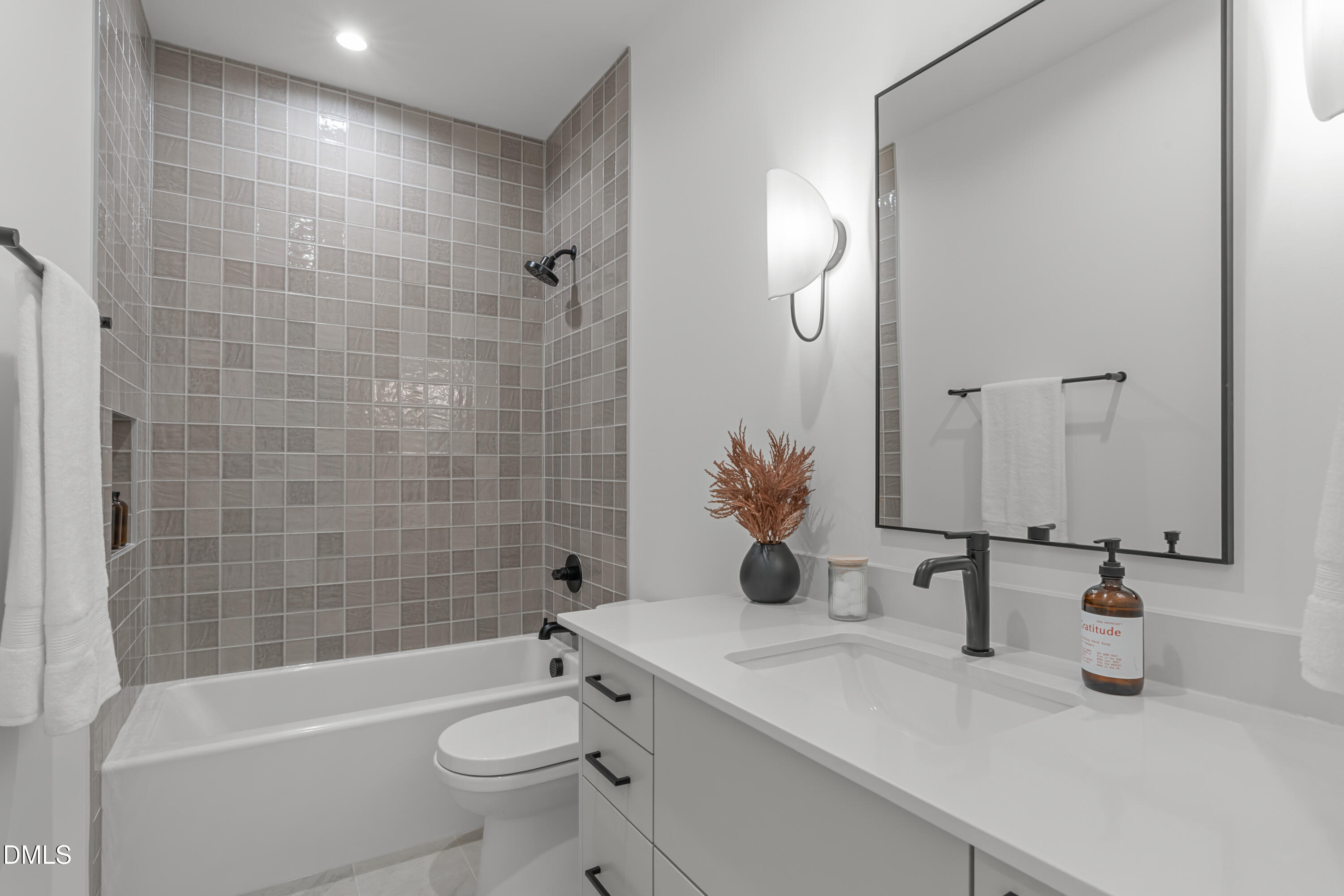 1307 Chamblee Hl Court Raleigh, NC 27608 - Photo 34 of 65 a bathroom with a granite countertop sink a toilet and shower