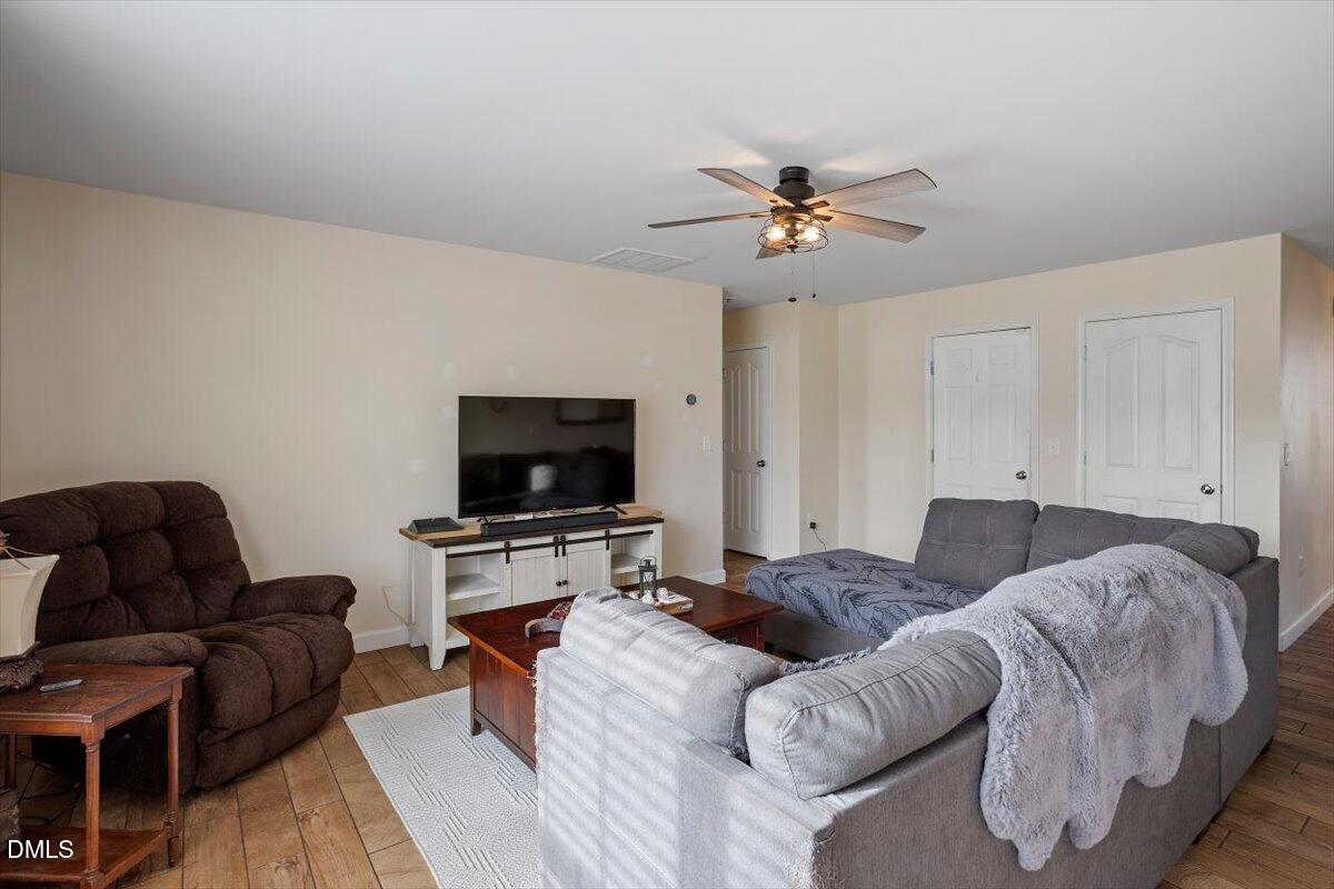 205 Battery Way Bunnlevel, NC 28323 - Photo 10 of 37 a living room with furniture and a flat screen tv