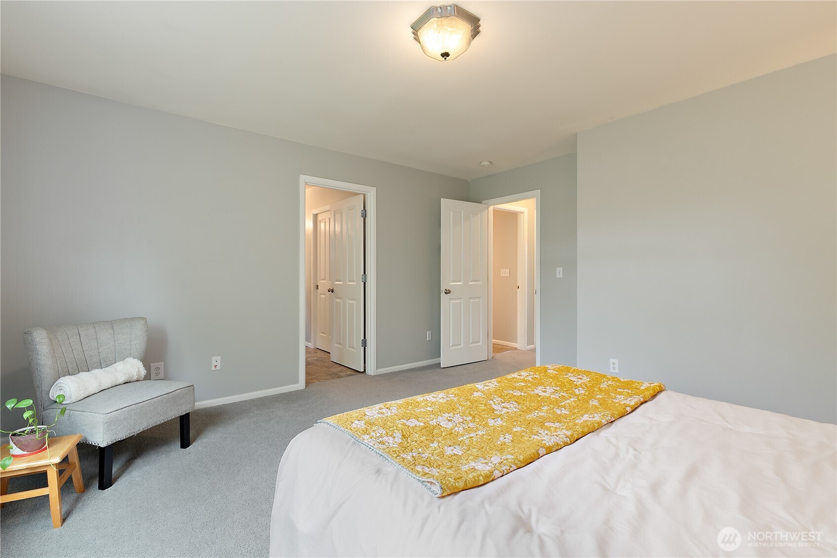 6600 Indiana Street Southeast Lacey, WA 98513 - Photo 13 of 21 a bedroom with a bed and a chair