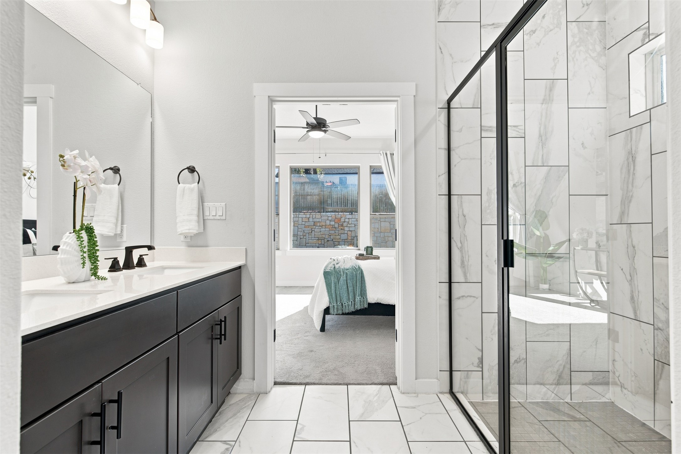 336 Berkeley Place Georgetown, TX 78628 - Photo 18 of 36 Elegant tile details and a modern glass shower frame the master bathroom layout.