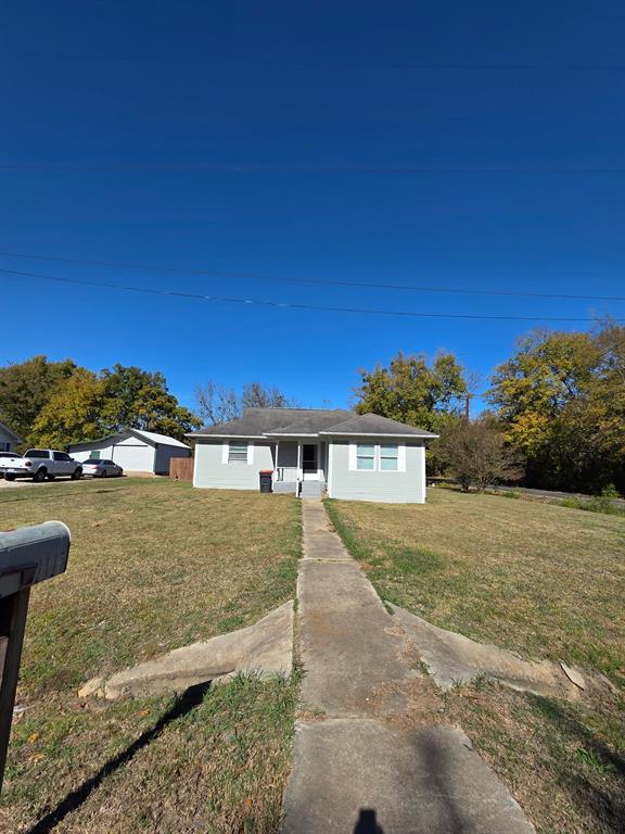 1145 Jefferson Road Paris, TX 75460 - Photo 13 of 14 a view of a house with a yard