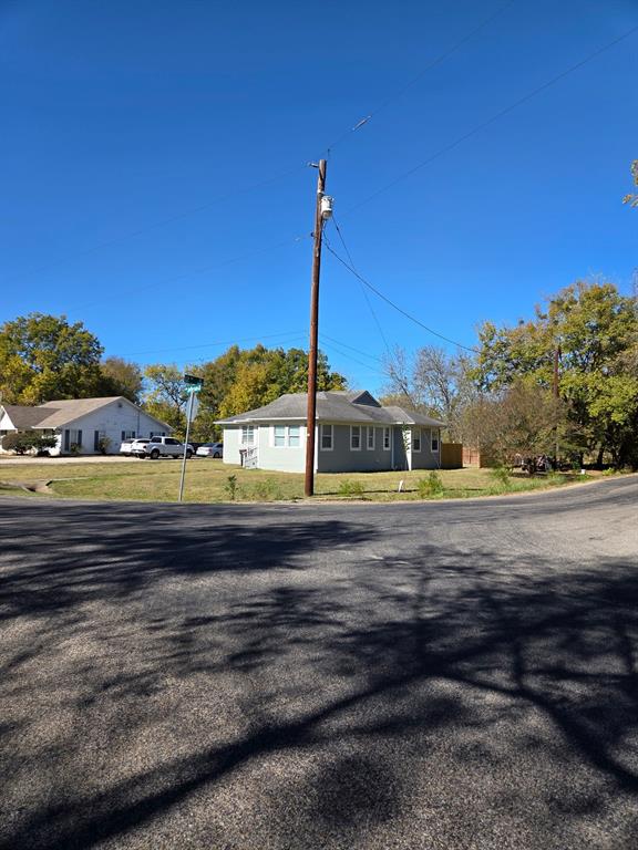 1145 Jefferson Road Paris, TX 75460 - Photo 5 of 14 a view of a road with a building in the background