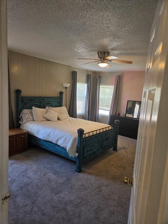 1145 Jefferson Road Paris, TX 75460 - Photo 7 of 14 a spacious bedroom with a bed and a mirror