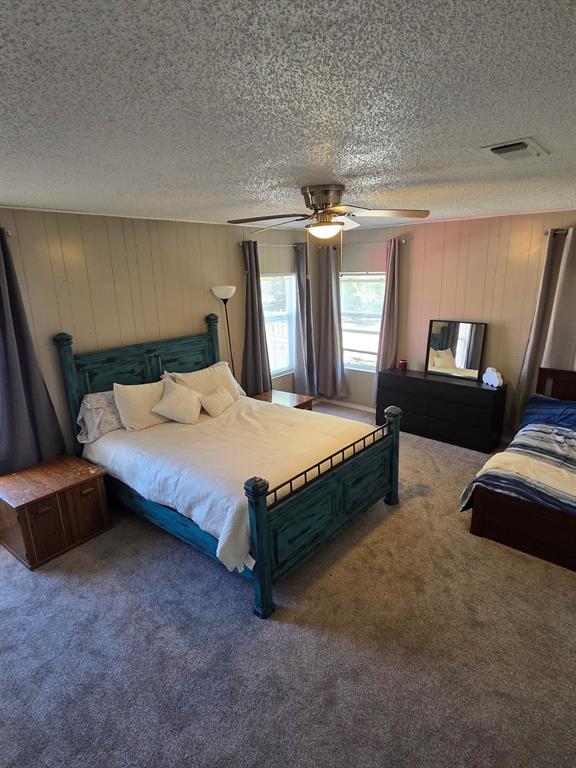 1145 Jefferson Road Paris, TX 75460 - Photo 8 of 14 a bedroom with a bed window and dresser