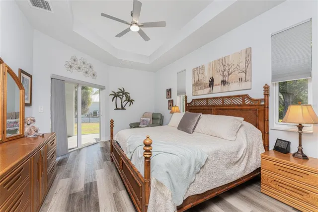 a bathroom with a tub a sink and mirror