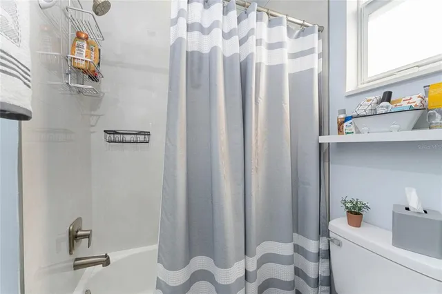 a view of a house with pool and a garden