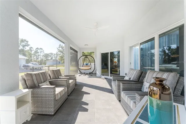 an aerial view of a house with a swimming pool