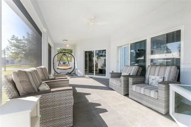 a view of a swimming pool with an outdoor seating yard and swimming pool