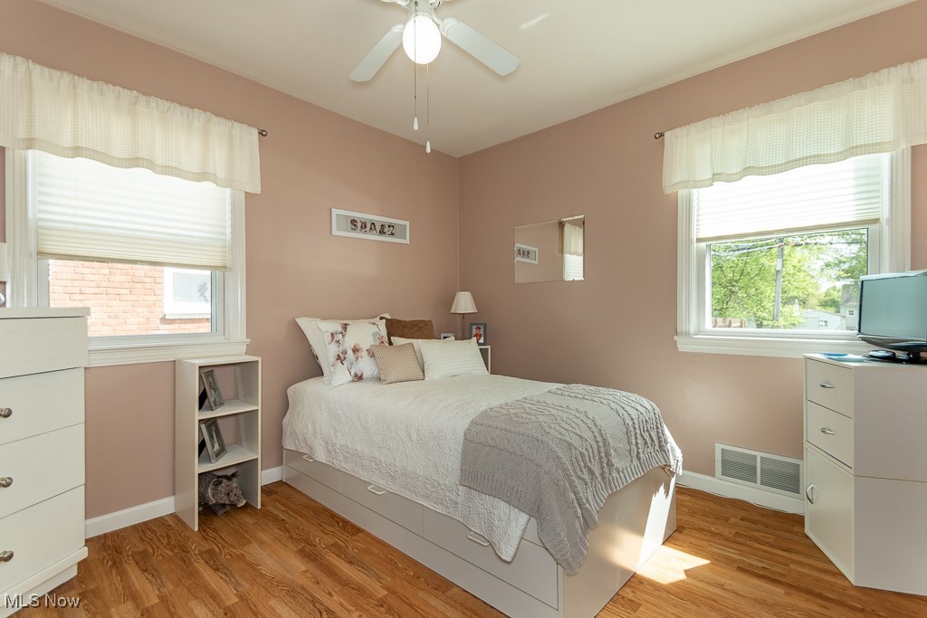 1237 Mayfield Ridge Road Cleveland, OH 44124 - Photo 8 of 38 Bedroom featuring light wood finished floors and a ceiling fan