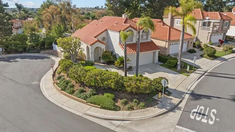 a view of a house with a small yard and plants
