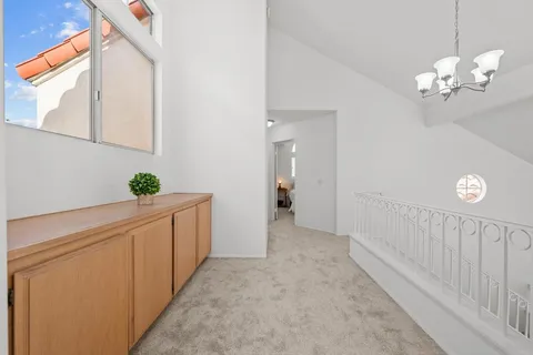 a view of a hallway with front door