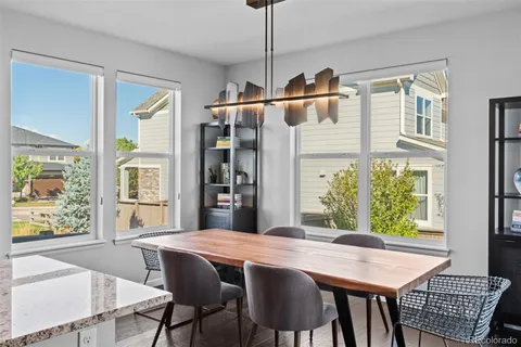 a dining room with a table chairs and a dining table