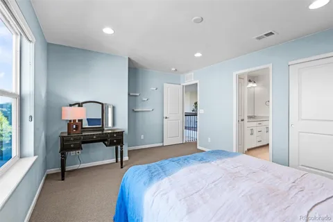 a bedroom with a bed and a table in it