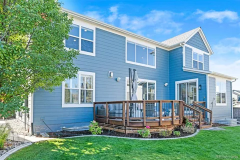 a front view of a house with a yard table and chairs