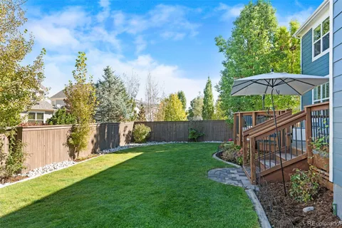 a view of a deck with a big yard