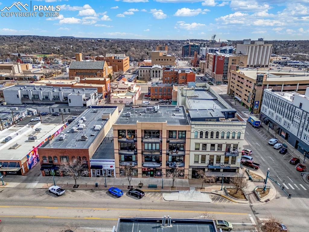 101 North Tejon Street, Unit 460 Colorado Springs, CO 80903 - Photo 34 of 49 an aerial view of a building with streets and trees