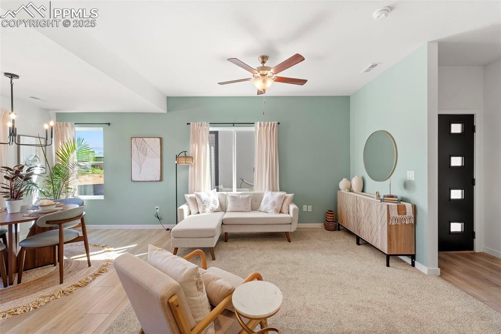 1920 Erin Loop Colorado Springs, CO 80918 - Photo 11 of 26 a living room with furniture and a wooden floor