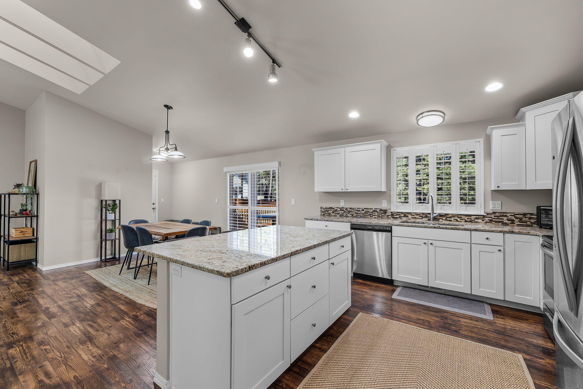 17064 Sacramento Road Bend, OR 97707 - Photo 12 of 50 a kitchen with sink stove and cabinets