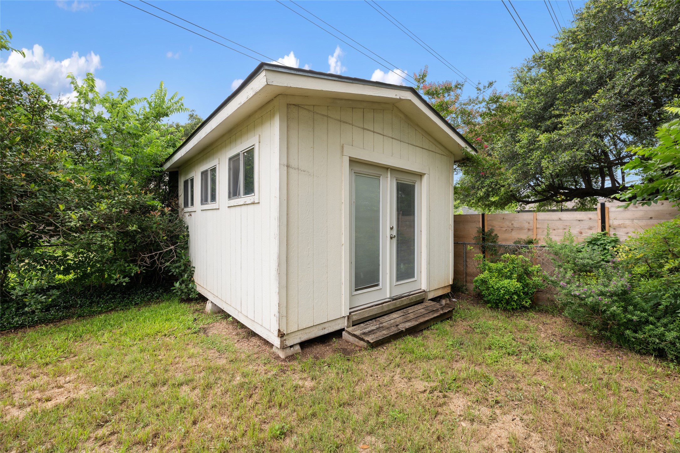 4602 Frontier Trail Austin, TX 78745 - Photo 19 of 21 A quaint backyard shed, perfect for extra storage or a private hideaway.