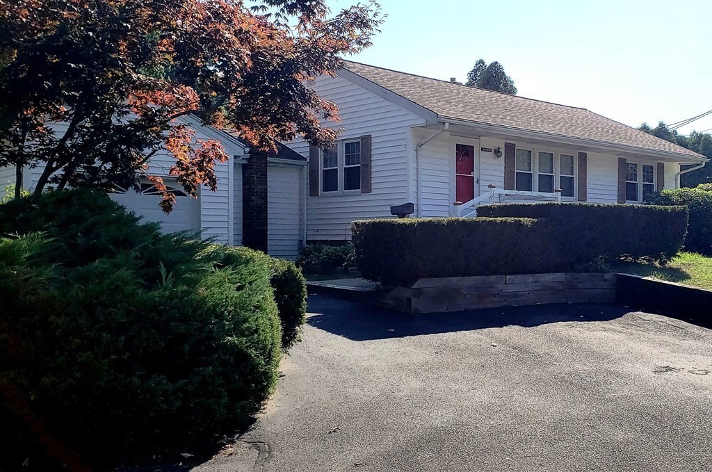 792 Ash Street Brockton, MA 02301 - Photo 1 of 42 a front view of a house with a yard