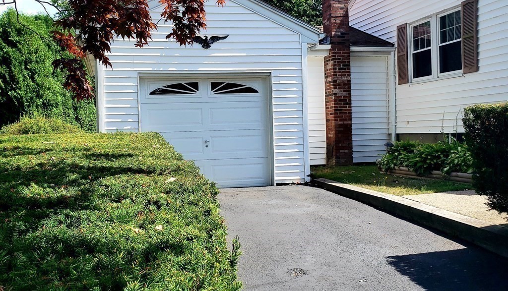 792 Ash Street Brockton, MA 02301 - Photo 22 of 42 a front view of a house with garden