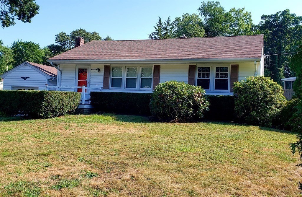 792 Ash Street Brockton, MA 02301 - Photo 3 of 42 a front view of a house with a garden