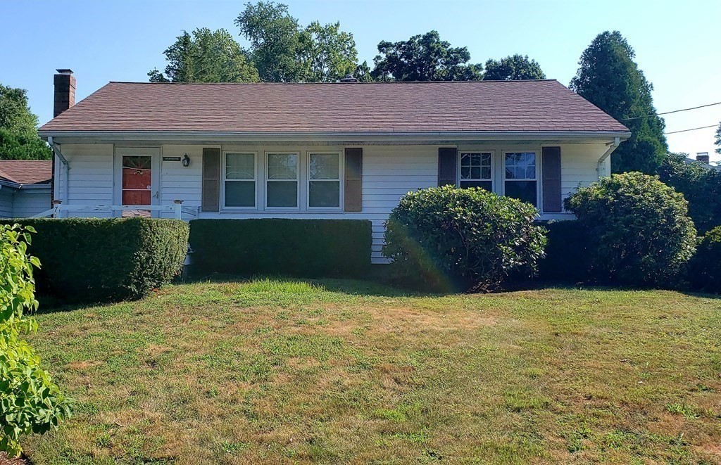 792 Ash Street Brockton, MA 02301 - Photo 4 of 42 a front view of a house with a garden