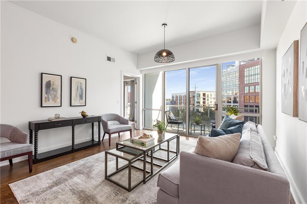 a living room with furniture and a large window