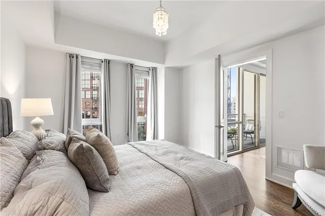 a bedroom with a large bed and a window