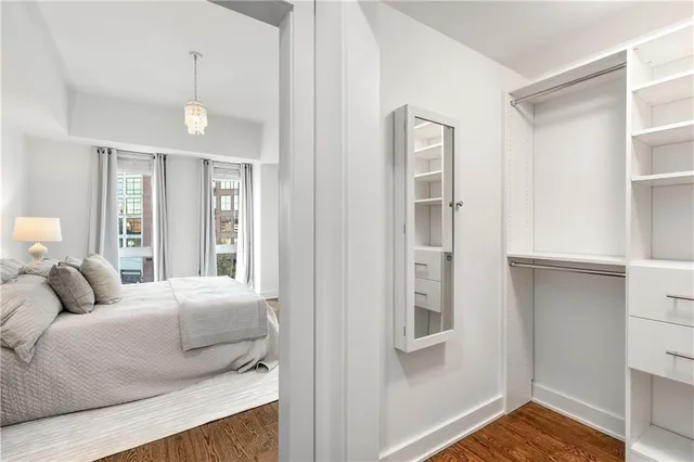 a bedroom with a large bed and a window