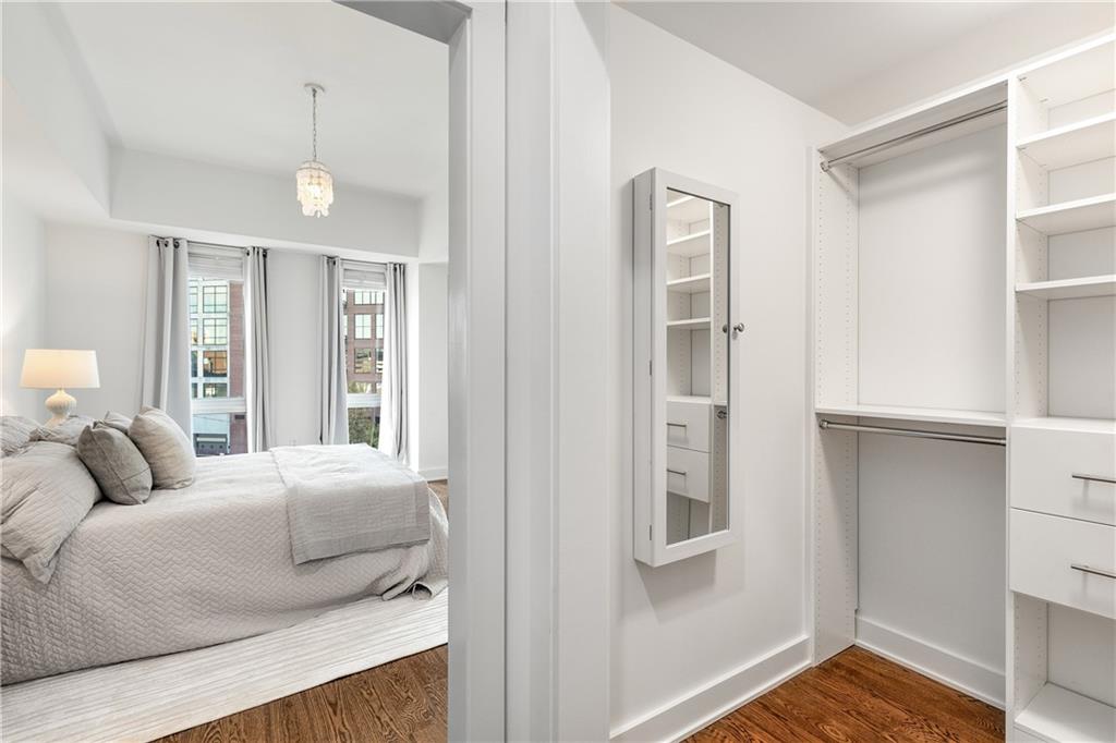 1100 Howell Mill Road Northwest, Unit 404 Atlanta, GA 30318 - Photo 23 of 45 a bedroom with a large bed and a window