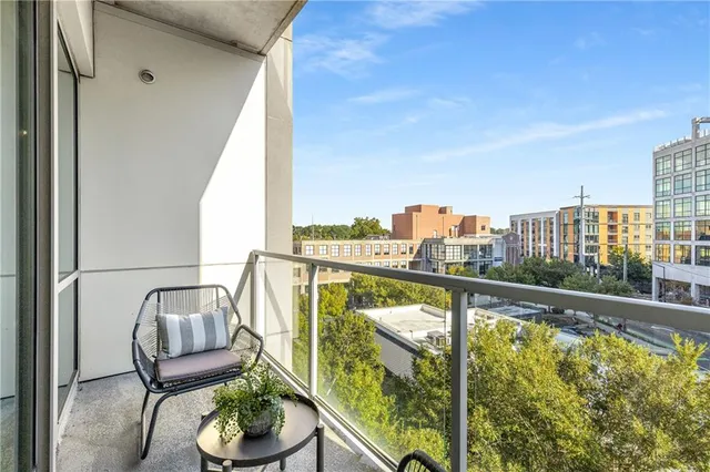 a view of a balcony with furniture
