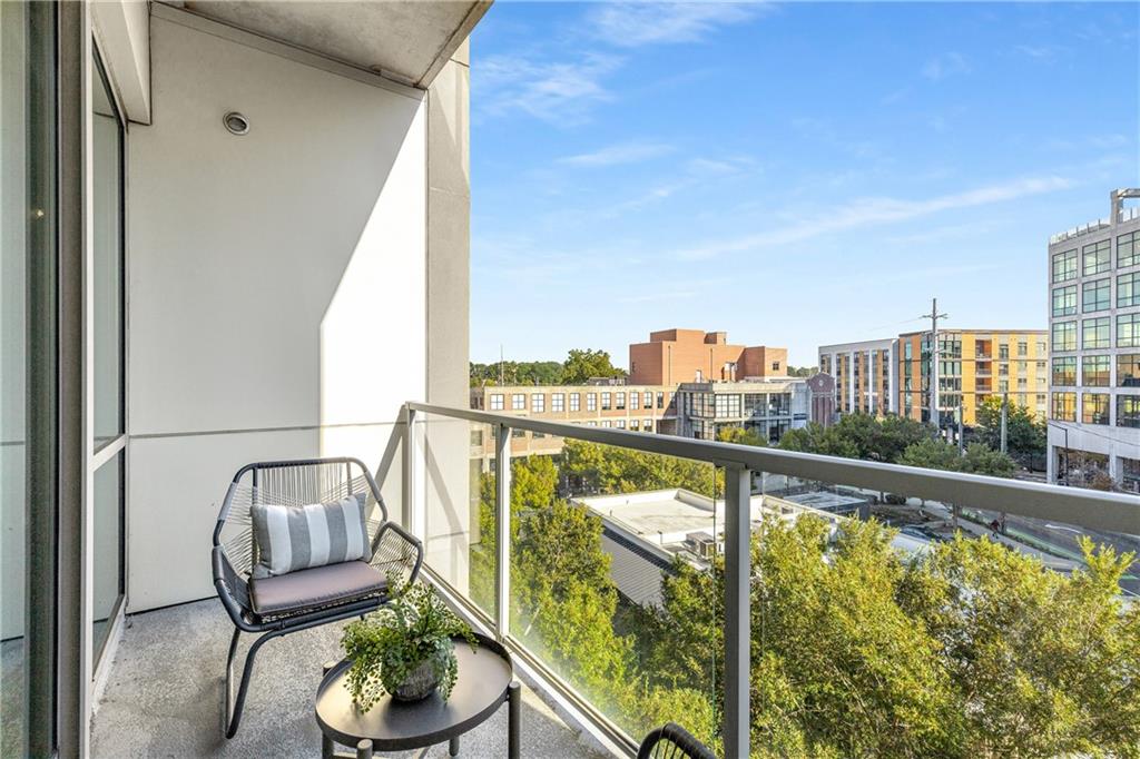 1100 Howell Mill Road Northwest, Unit 404 Atlanta, GA 30318 - Photo 26 of 45 a view of a balcony with furniture