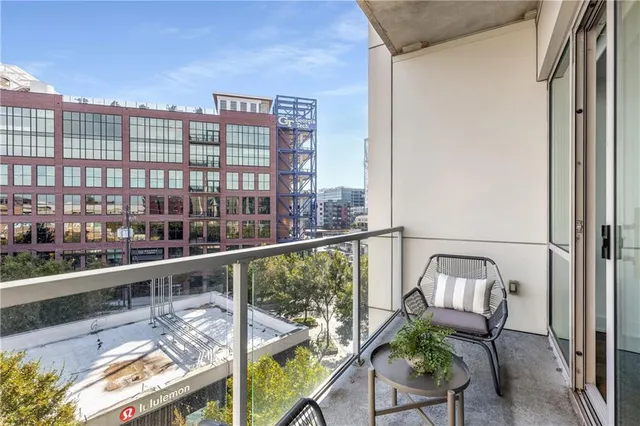 a view of a balcony with chairs