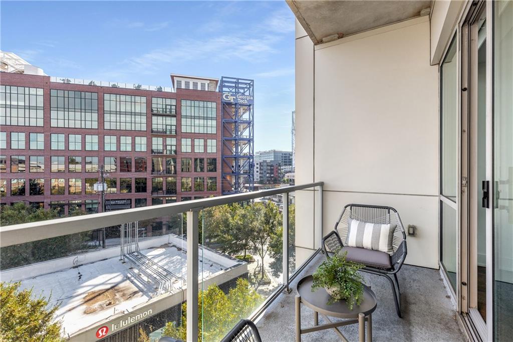 1100 Howell Mill Road Northwest, Unit 404 Atlanta, GA 30318 - Photo 27 of 45 a view of a balcony with chairs