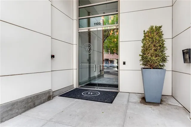 a view of living room with furniture and a fireplace