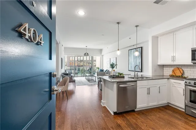 a kitchen with lots of counter top space and wooden floor