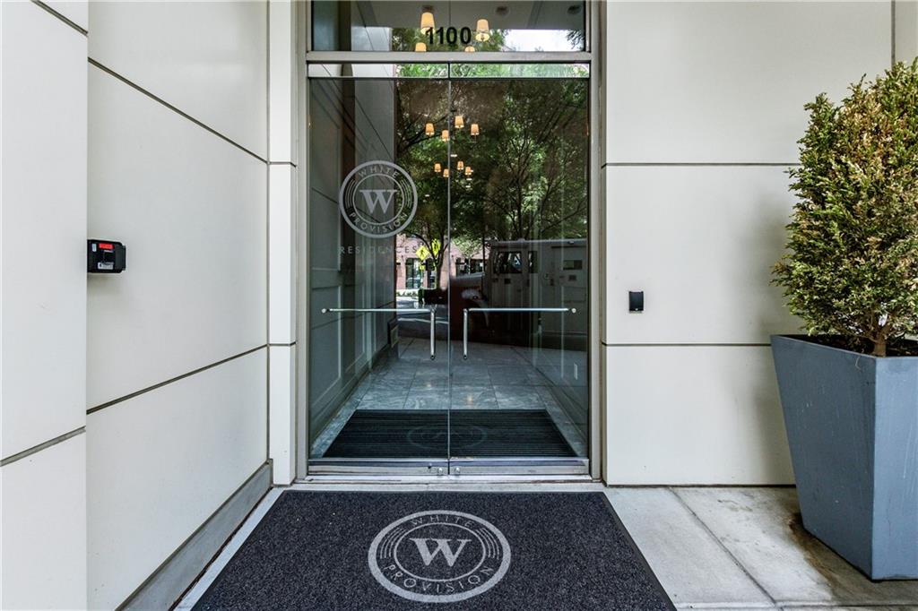 1100 Howell Mill Road Northwest, Unit 404 Atlanta, GA 30318 - Photo 31 of 45 a view of living room with furniture and a fireplace