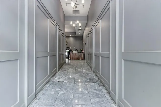 a view of a livingroom with furniture and a flat screen tv
