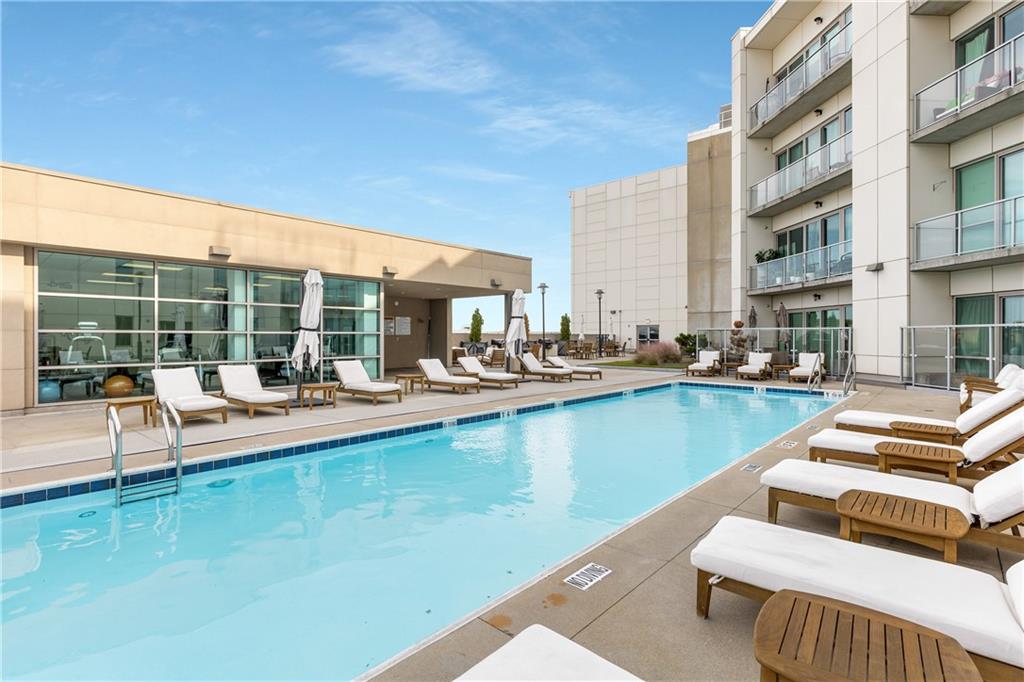 1100 Howell Mill Road Northwest, Unit 404 Atlanta, GA 30318 - Photo 40 of 45 a view of swimming pool with outdoor seating and a couch