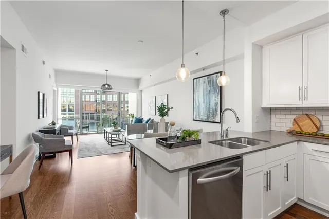 a kitchen with sink cabinets and wooden floor