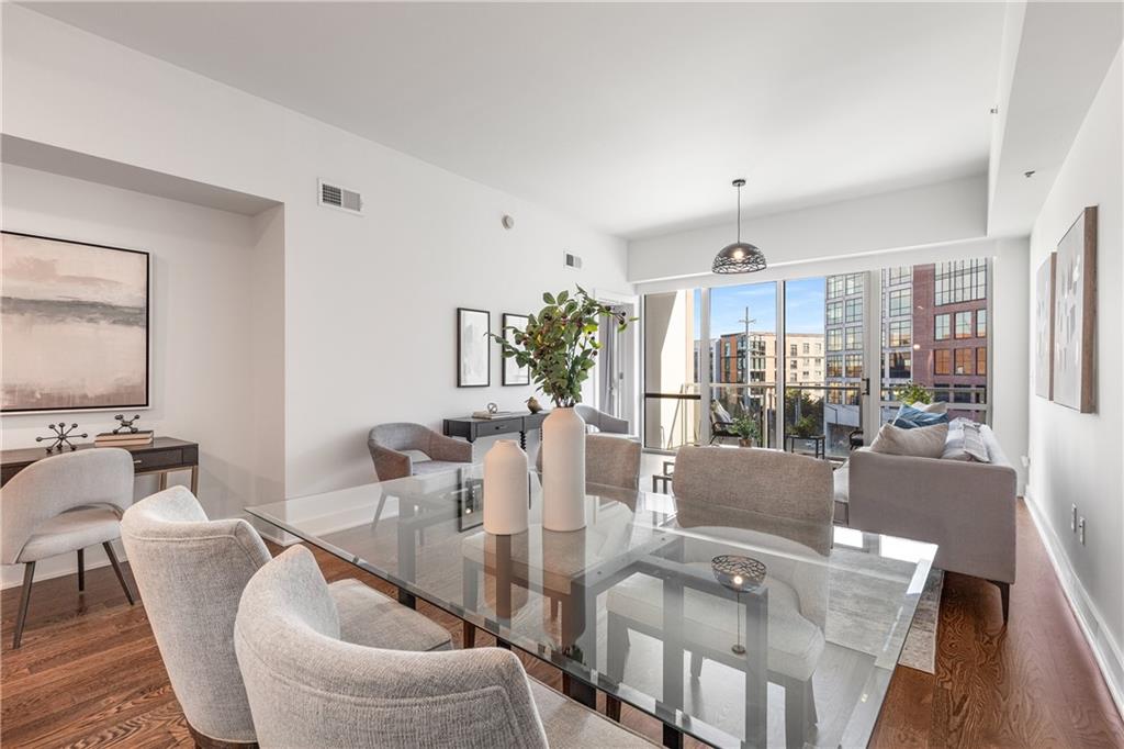 1100 Howell Mill Road Northwest, Unit 404 Atlanta, GA 30318 - Photo 10 of 45 a living room with furniture and a flat screen tv