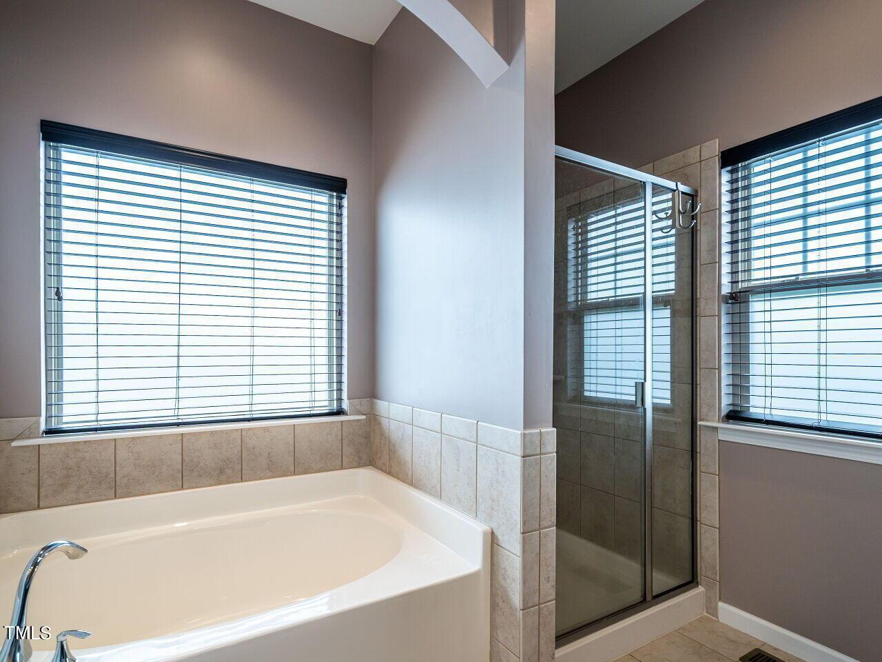 1316 Cornell Place Raleigh, NC 27607 - Photo 20 of 31 a bathroom with a bathtub and window