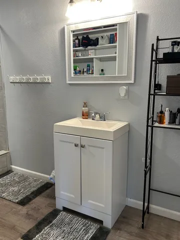 a utility room with sink dryer and washer