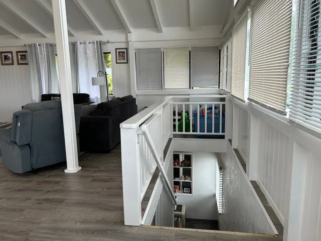 a view of an entryway with wooden floor